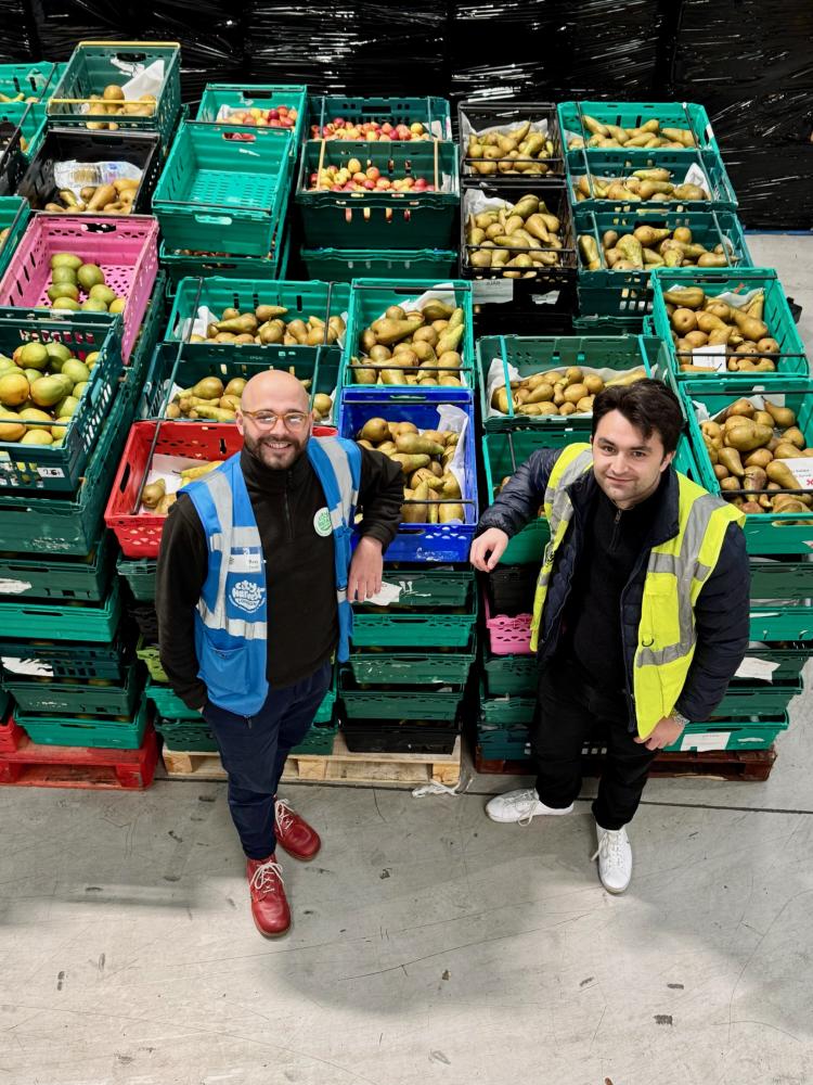 FFTO General Manager with their produce to donate to City Harvest